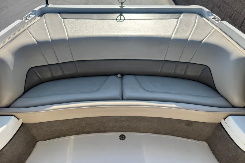 Slide: The Image of Interior seating of a 1996 Cobalt 232 boat, featuring gray upholstery. - 14