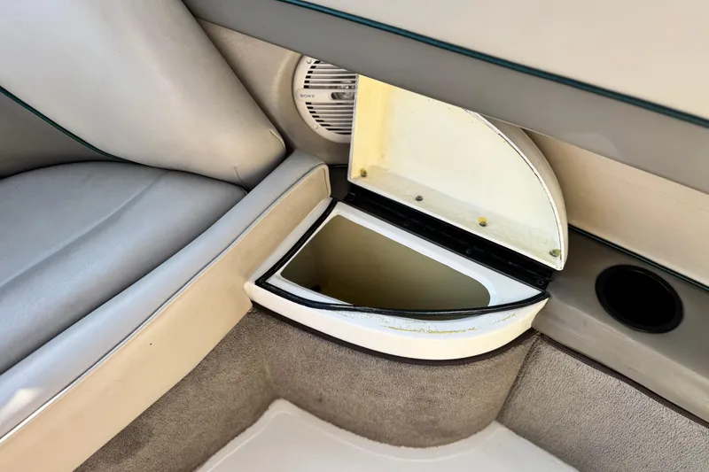 Slide: The Image of Interior of 1996 Cobalt 232 boat showing storage compartment and speaker. - 18