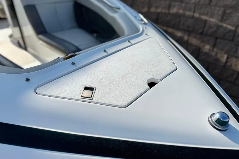 Slide: The Image of Close-up of a 1996 Cobalt 232 boat's bow with seating and storage compartment. - 8