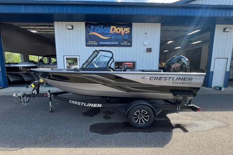The Image of 2026 Crestliner 1750 Super Hawk boat on trailer outside Lake Days Marine. - 0