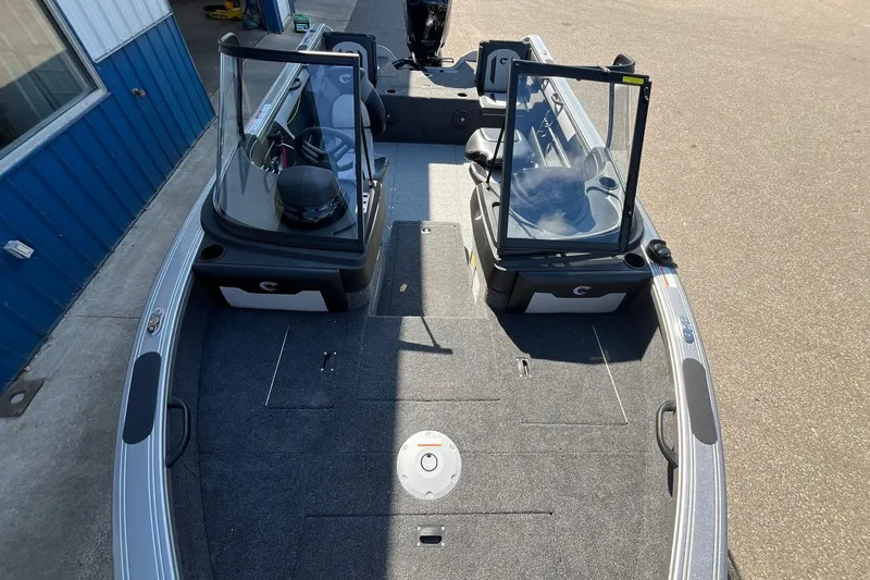 Slide: The Image of 2026 Crestliner 1750 Super Hawk boat interior with open windshield and seating. - 11