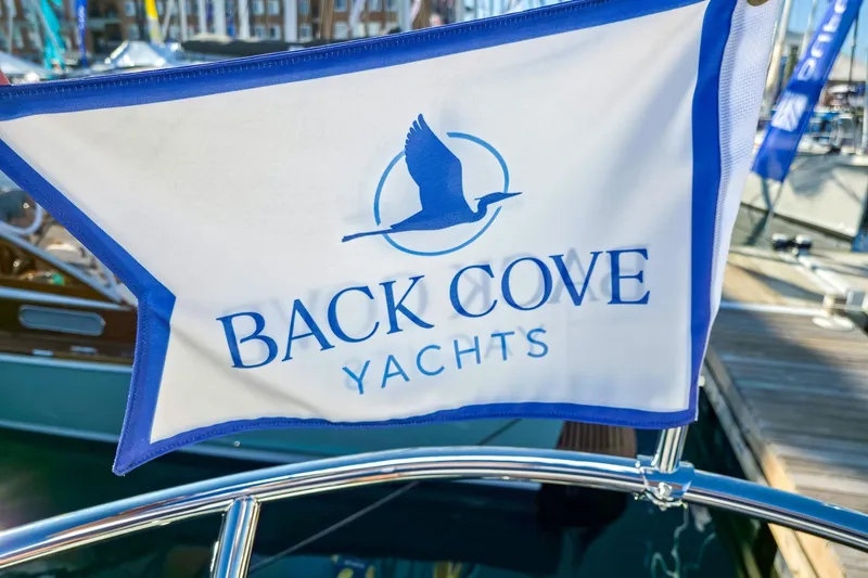 Slide: The Image of Flag displaying Back Cove Yachts logo on a boat, model 412, year 2026. - 12