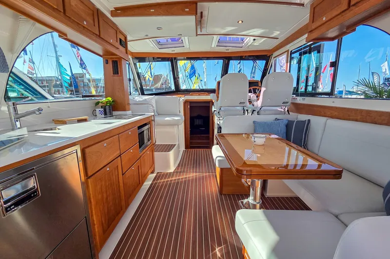 Slide: The Image of Luxurious interior of 2026 Back Cove 412 yacht with modern kitchen and seating area. - 22