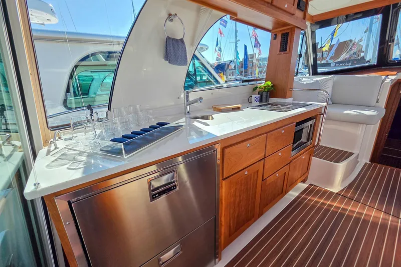 Slide: The Image of Luxurious interior of 2026 Back Cove 412 yacht with modern kitchen amenities. - 24