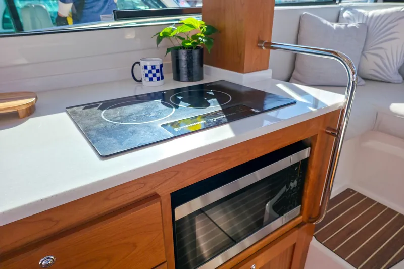 Slide: The Image of Modern kitchen area in 2026 Back Cove 412 yacht with stove and microwave. - 27