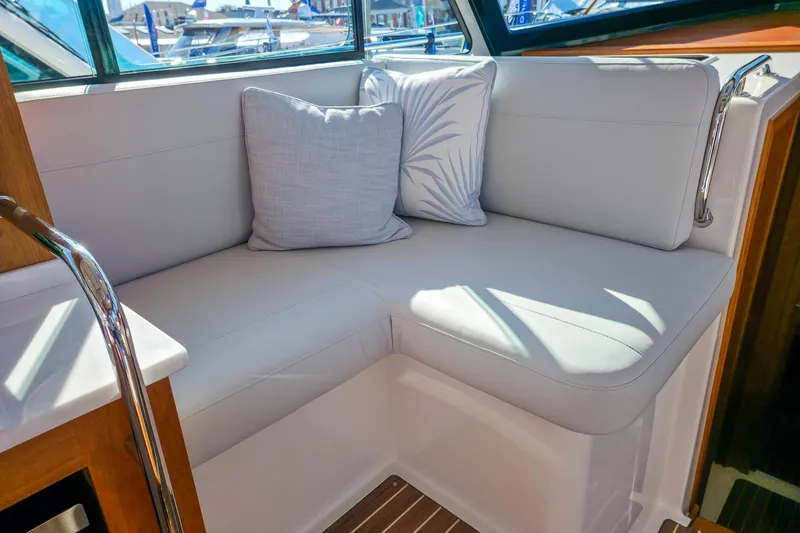 Slide: The Image of Luxurious seating area on 2026 Back Cove 412 yacht with plush cushions. - 28