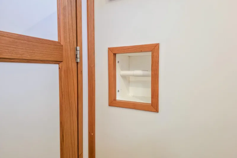 Slide: The Image of Wood-framed toilet paper holder in Back Cove 412, 2026 model. - 40