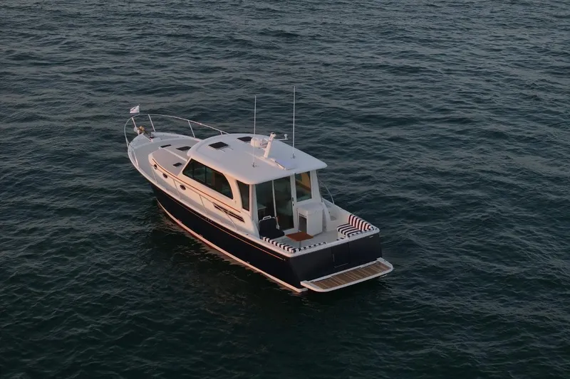 Slide: The Image of 2026 Back Cove 412 yacht on calm ocean waters, aerial view. - 5