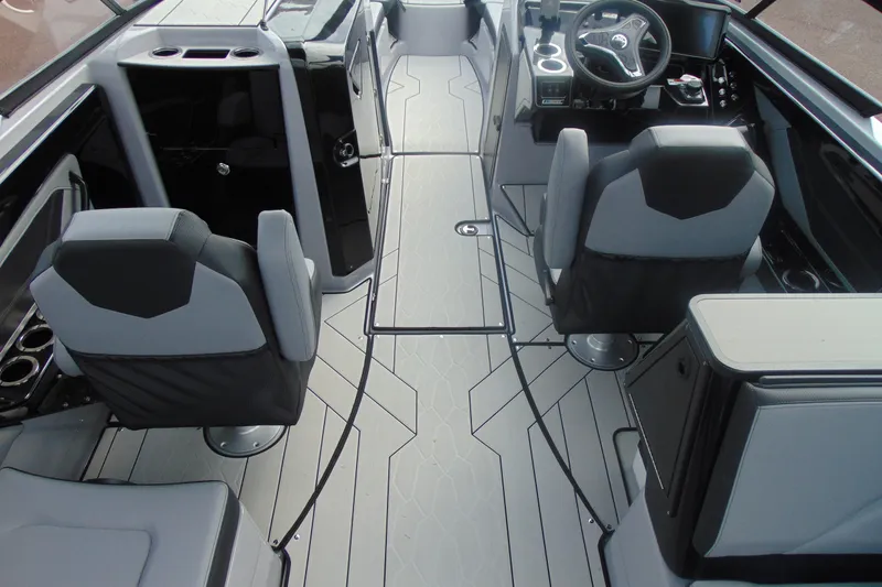 Slide: The Image of Interior of 2026 Yamaha Boats 255XD, featuring modern seating and sleek dashboard design. - 11