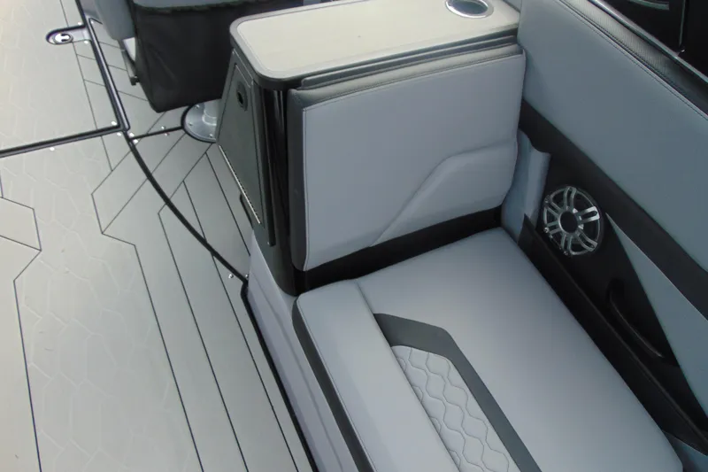 Slide: The Image of Interior seating of 2026 Yamaha Boats 255XD with modern design and speaker system. - 12