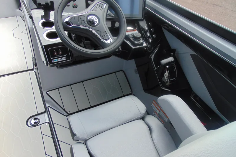 Slide: The Image of 2026 Yamaha Boats 255XD cockpit with modern steering and controls. - 15