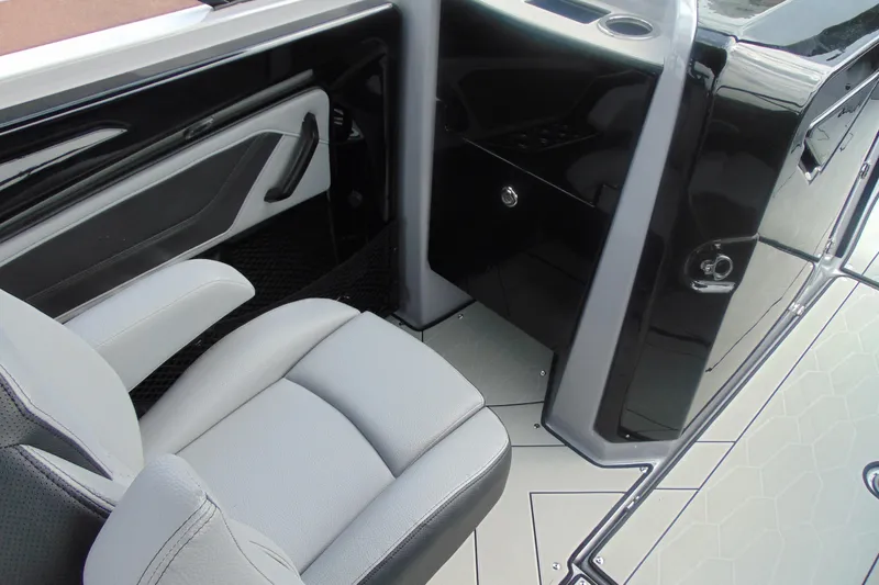 Slide: The Image of 2026 Yamaha Boats 255XD interior with sleek seating and modern design. - 16