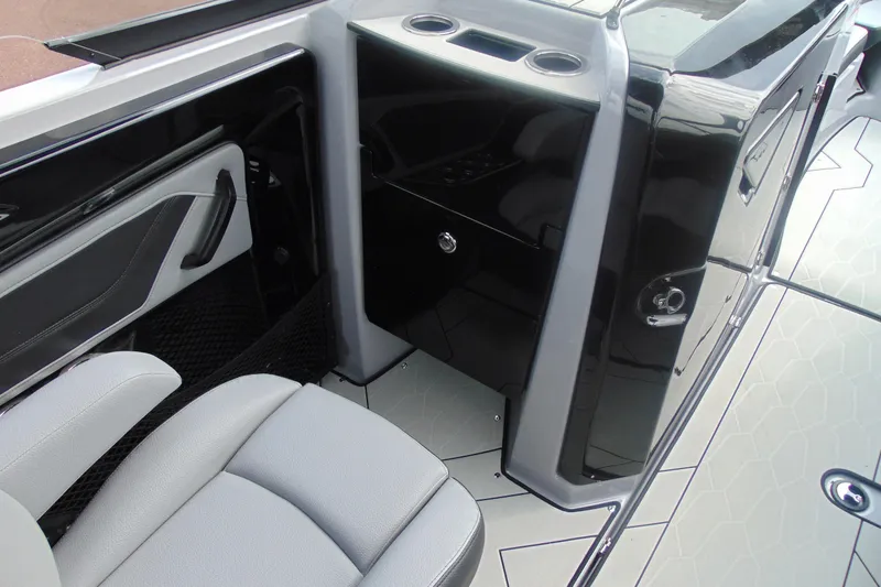 Slide: The Image of 2026 Yamaha Boats 255XD interior with sleek seating and modern console design. - 19