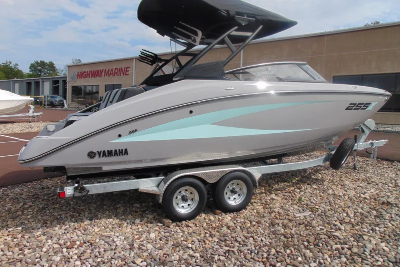 The Image of 2026 Yamaha Boats 255XD on trailer at Highway Marine dealership. - 2