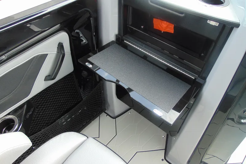 Slide: The Image of 2026 Yamaha Boats 255XD interior with fold-out table and modern design. - 20