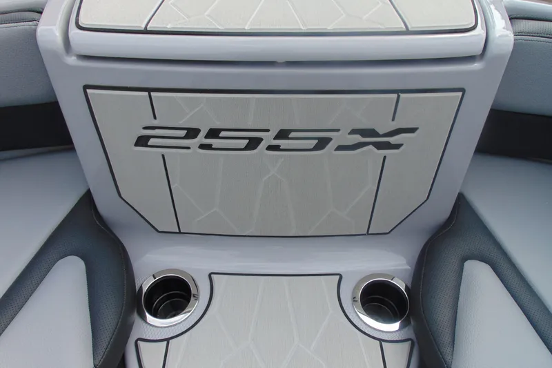 Slide: The Image of 2026 Yamaha Boats 255XD interior detail with cup holders and stylish design. - 22