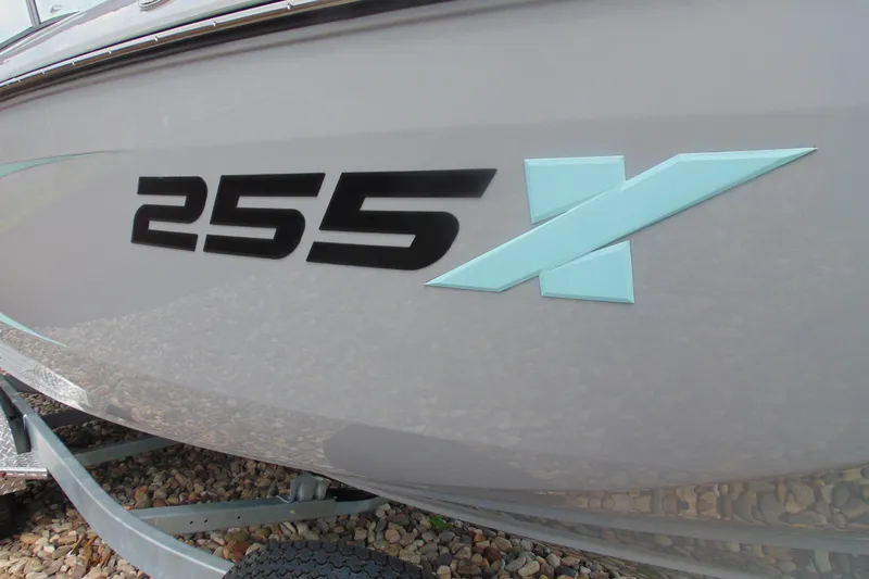 Slide: The Image of 2026 Yamaha Boats 255XD model logo on sleek gray hull. - 4