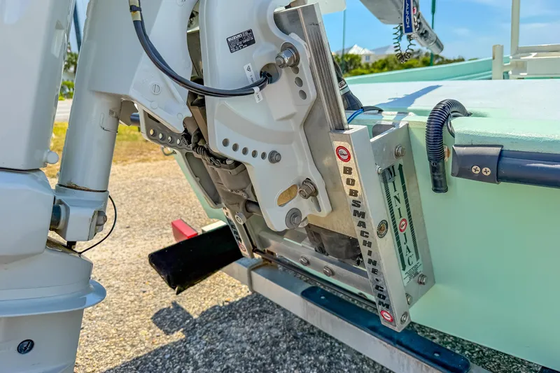 Slide: The Image of Close-up of a 2021 Custom 15' Tiller Skiff motor mount on a sunny day. - 11