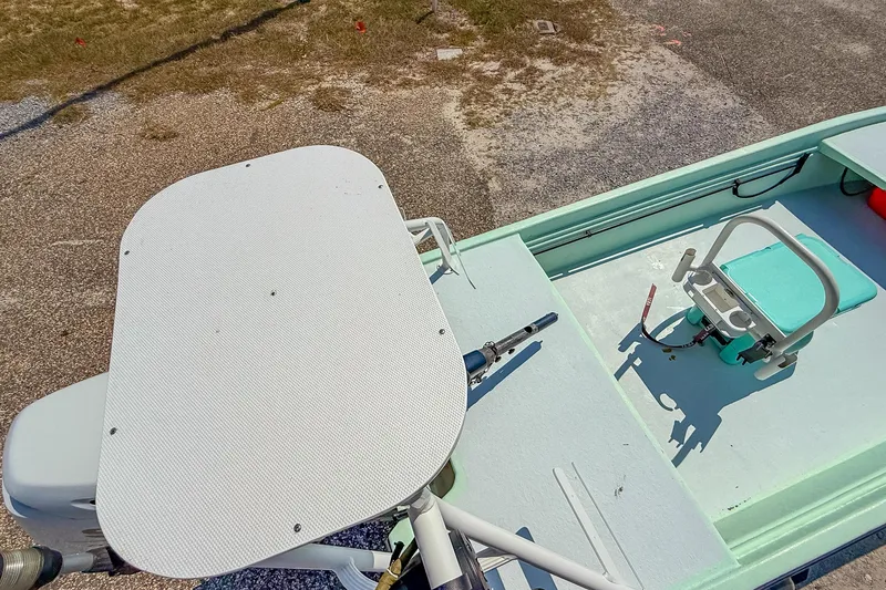 Slide: The Image of 15' Custom Tiller Skiff, 2021 model, featuring a minimalist deck and seating arrangement. - 19