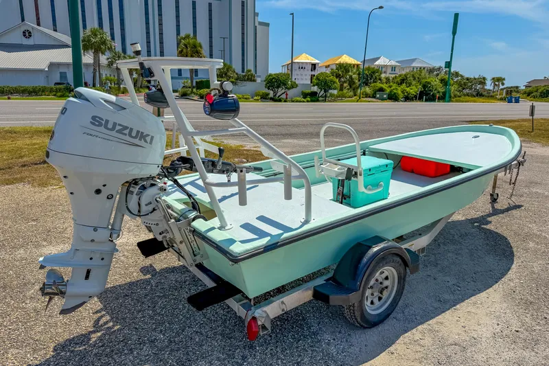 Slide: The Image of 15' Custom Tiller Skiff boat with Suzuki outboard motor on trailer, 2021 model. - 7