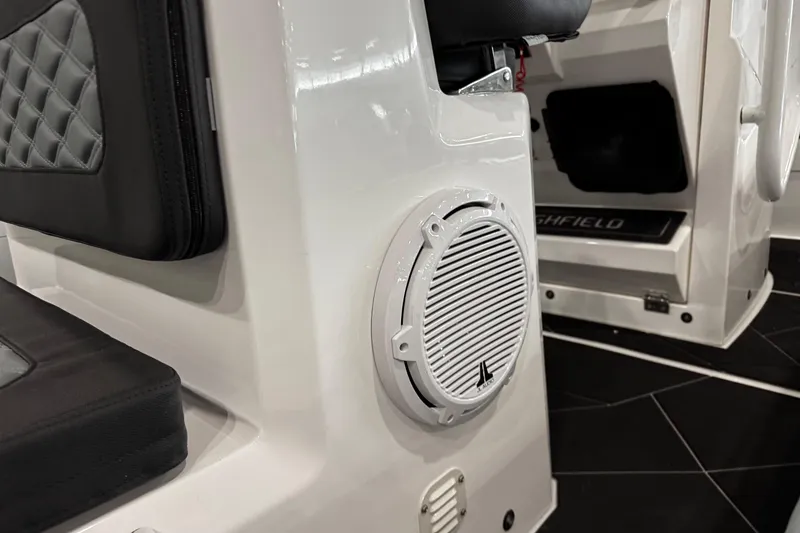 Slide: The Image of Highfield Sport 800 (2026) boat interior with speaker and cushioned seating detail. - 10