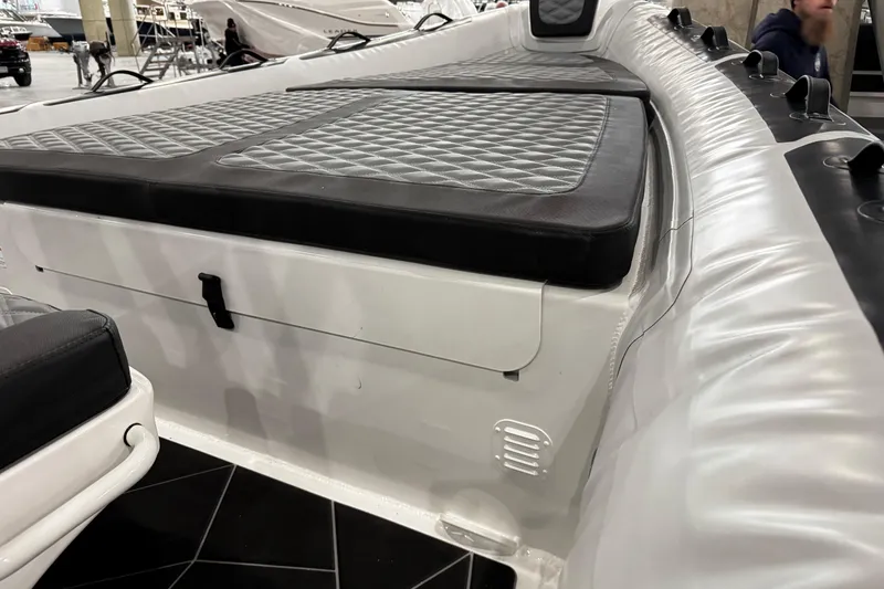 Slide: The Image of 2026 Highfield Sport 800 boat interior with cushioned seating and sleek design. - 11