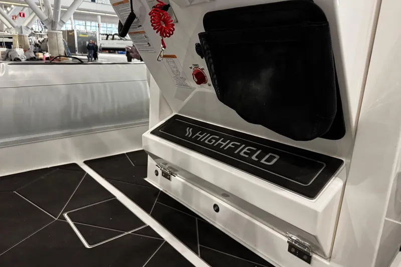 Slide: The Image of 2026 Highfield Sport 800 boat interior with branded step and safety features. - 14