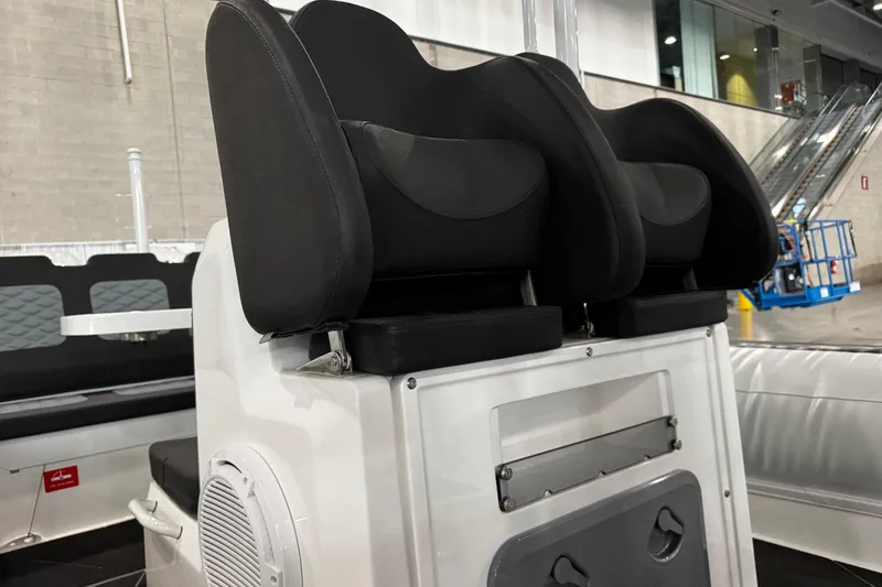 Slide: The Image of 2026 Highfield Sport 800 boat seats in a showroom setting. - 9