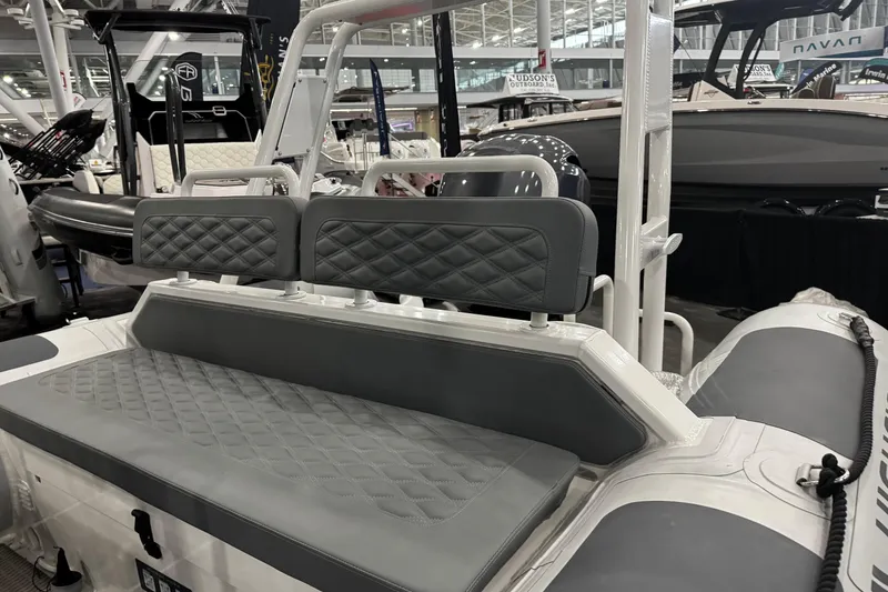 Slide: The Image of 2026 Highfield Patrol 540 boat interior with cushioned seating and modern design. - 10