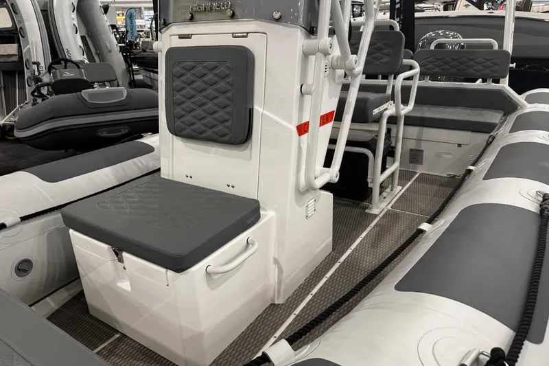 Slide: The Image of 2026 Highfield Patrol 540 boat interior with cushioned seating and modern design. - 7