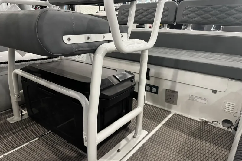 Slide: The Image of 2026 Highfield Patrol 540 boat interior with cushioned seating and modern design. - 8