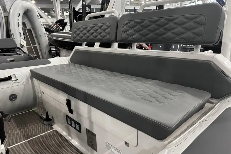 Slide: The Image of Interior view of 2026 Highfield Patrol 540 boat, featuring seating and storage area. - 9