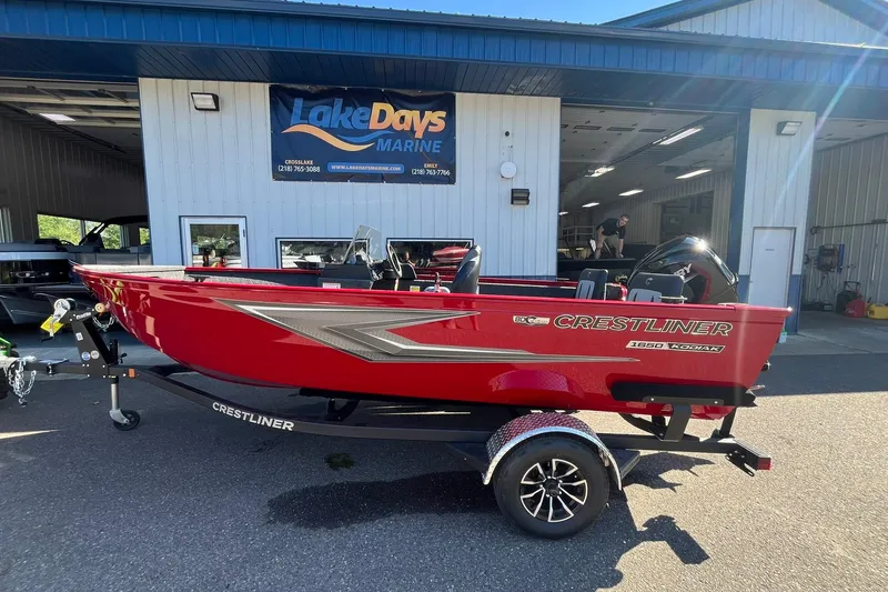 The Image of 2026 Crestliner 1650 Kodiak boat in vibrant red, displayed at Lake Days Marine. - 0