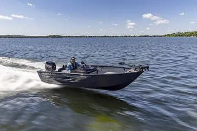 Slide: The Image of Manufacturer Provided Image: 2026 Crestliner 1650 Kodiak boat speeding on a lake under a clear blue sky. - 13