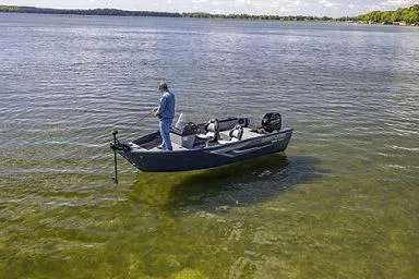 Slide: The Image of Manufacturer Provided Image: A person fishing on a 2026 Crestliner 1650 Kodiak boat in a calm lake. - 15