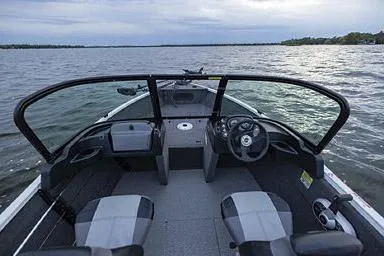 Slide: The Image of Manufacturer Provided Image: 2026 Crestliner 1650 Kodiak boat interior with dual seats, steering wheel, and open water view. - 18