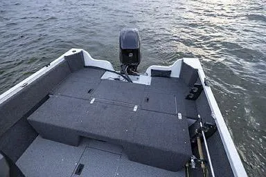 Slide: The Image of Manufacturer Provided Image: 2026 Crestliner 1650 Kodiak boat interior with motor, on water. - 20