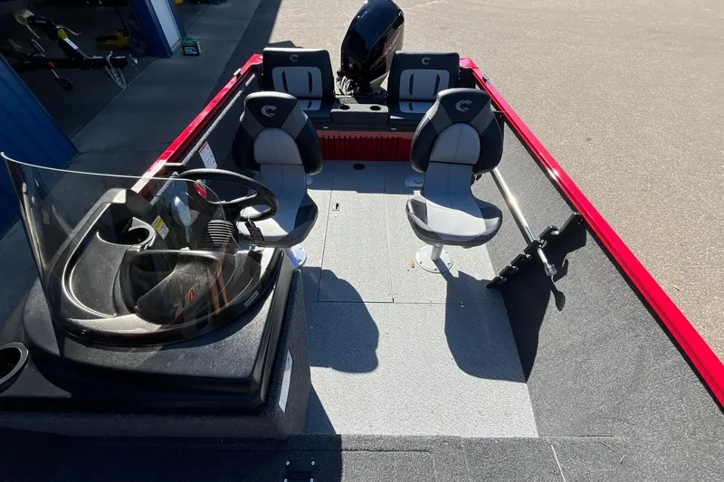 Slide: The Image of 2026 Crestliner 1650 Kodiak boat interior with seating and steering console. - 8