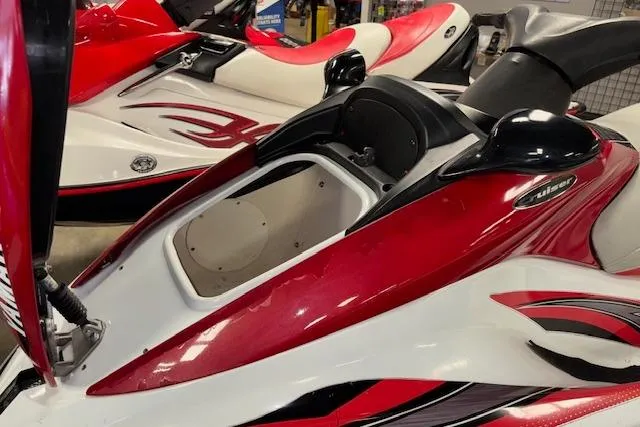 Slide: The Image of 2002 Yamaha WaveRunner FX Cruiser in red and white, showcasing sleek design and storage compartment. - 10