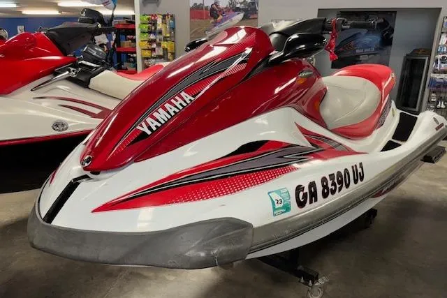 Slide: The Image of 2002 Yamaha WaveRunner FX Cruiser in red and white, displayed indoors. - 3