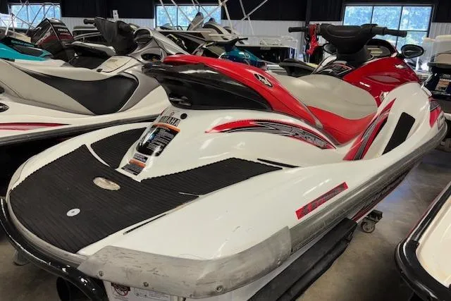 Slide: The Image of 2002 Yamaha WaveRunner FX Cruiser in showroom, red and white design, side view. - 4