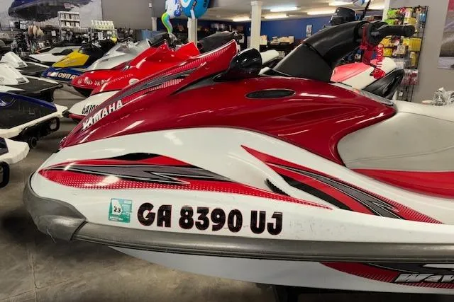 Slide: The Image of 2002 Yamaha WaveRunner FX Cruiser in showroom, red and white design, registration GA 8390 UJ. - 8