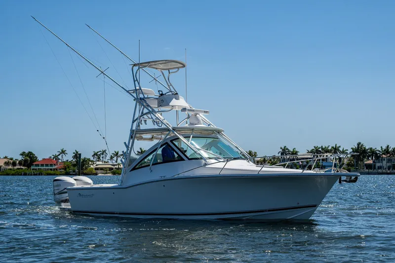 Slide: The Image of 2018 Albemarle 290 Express Fisherman boat on calm water, clear sky background. - 15