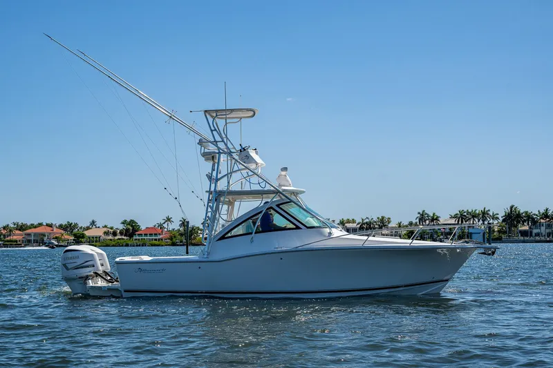 Slide: The Image of 2018 Albemarle 290 Express Fisherman boat on calm water, clear sky background. - 18