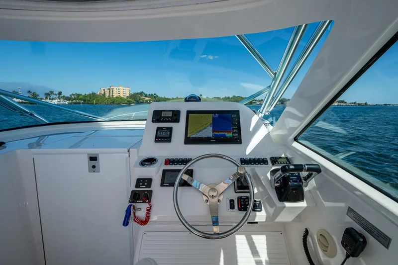 Slide: The Image of Helm of 2018 Albemarle 290 Express Fisherman with navigation equipment and ocean view. - 26