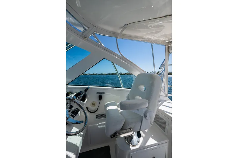 Slide: The Image of 2018 Albemarle 290 Express Fisherman helm with white captain's chair and ocean view. - 27