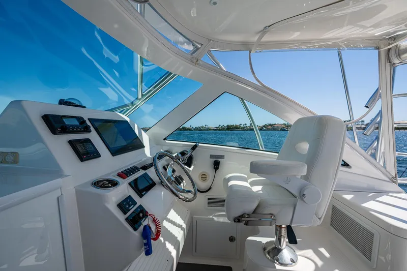 Slide: The Image of 2018 Albemarle 290 Express Fisherman helm with modern controls and ocean view. - 28