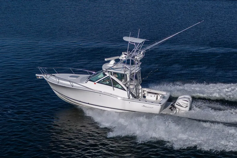 Slide: The Image of 2018 Albemarle 290 Express Fisherman boat cruising on open water. - 3