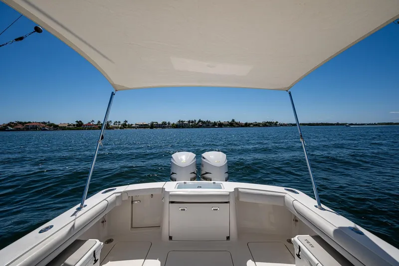 Slide: The Image of 2018 Albemarle 290 Express Fisherman boat on open water under a canopy. - 33