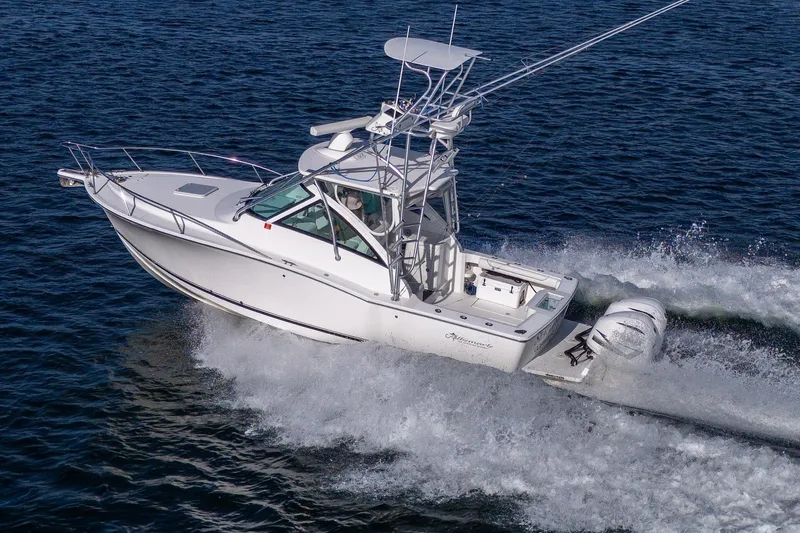Slide: The Image of 2018 Albemarle 290 Express Fisherman boat cruising on open water. - 4